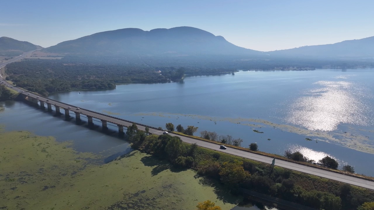 A road bridge crossing Hartbeespoort Dam